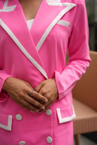Women's pink blazer dress with a high neckline for evening formals.