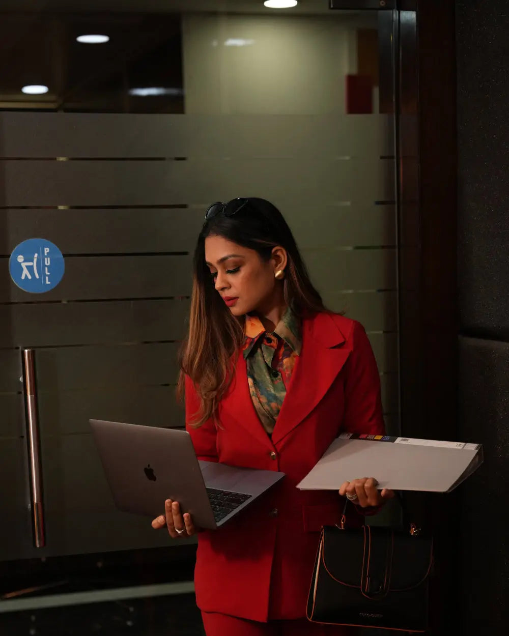 Bold red blazer suit set for corporate events.