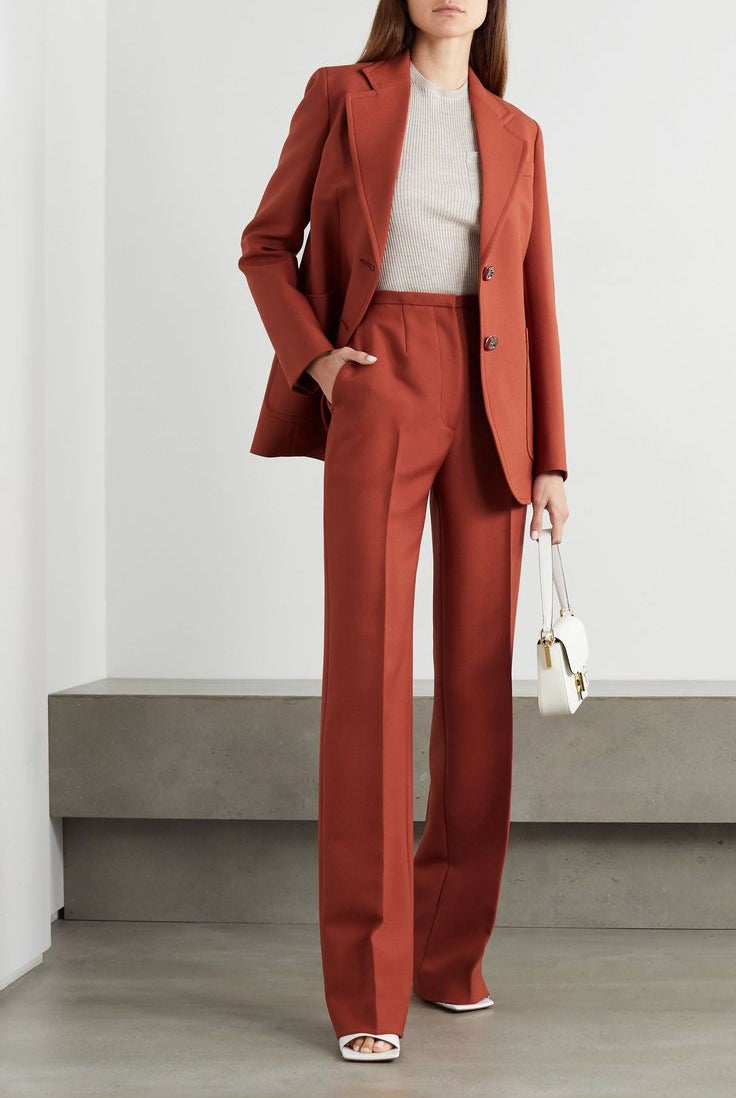 Women's rust blazer suit set with a modern tailored fit and straight leg pants.