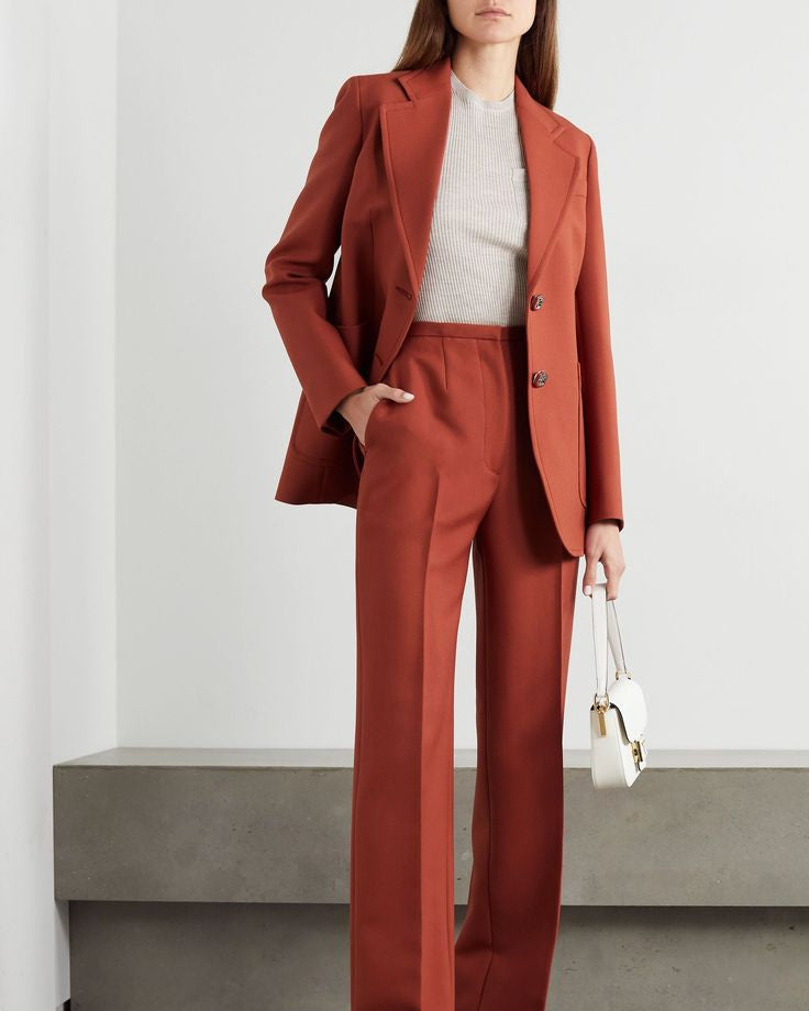 Women's rust blazer suit set with a modern tailored fit and straight leg pants.
