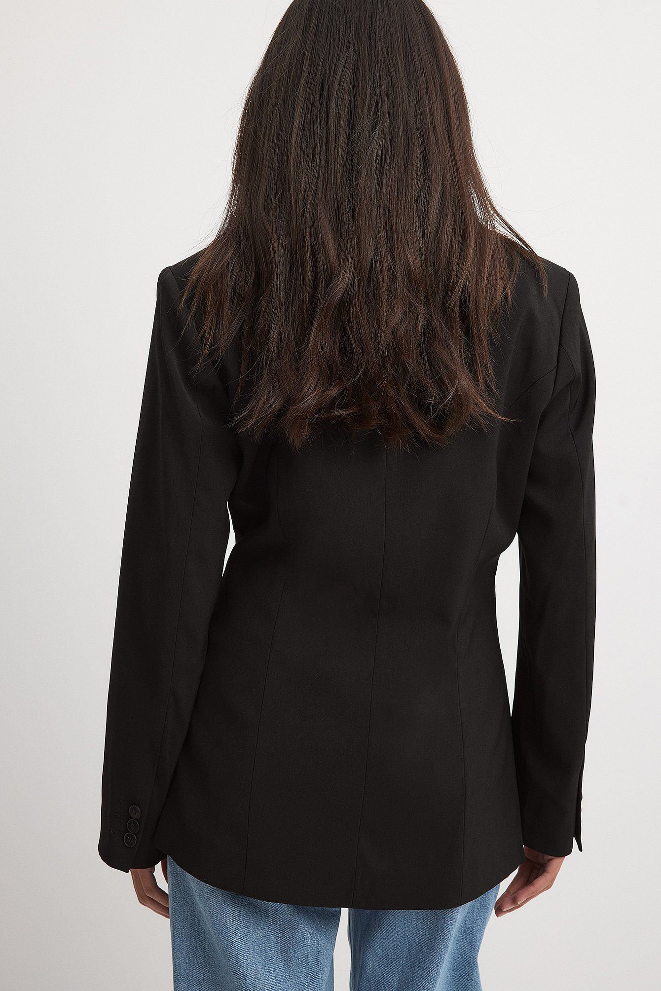 Women's black blazer with padded shoulders and a tailored fit.