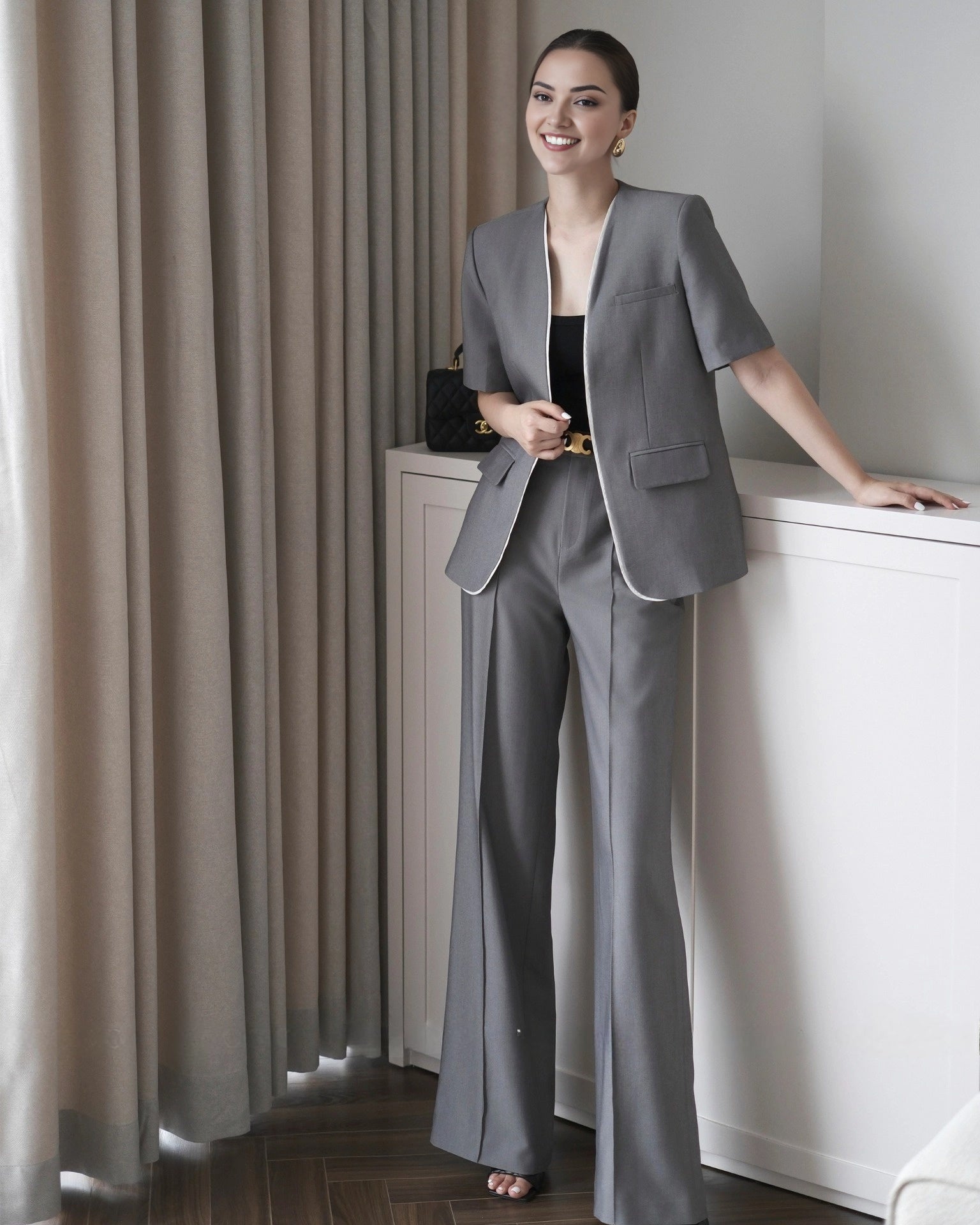 Women's cotton short sleeve co-ord set featuring a longline blazer and tailored pants.