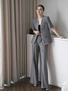 Women's cotton short sleeve co-ord set featuring a longline blazer and tailored pants.