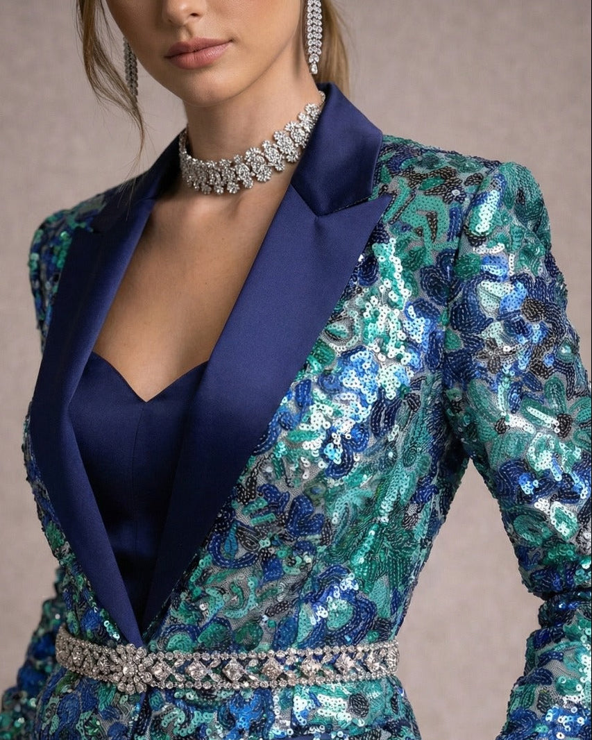 Blue floral sequin blazer with a matching top on a neutral background