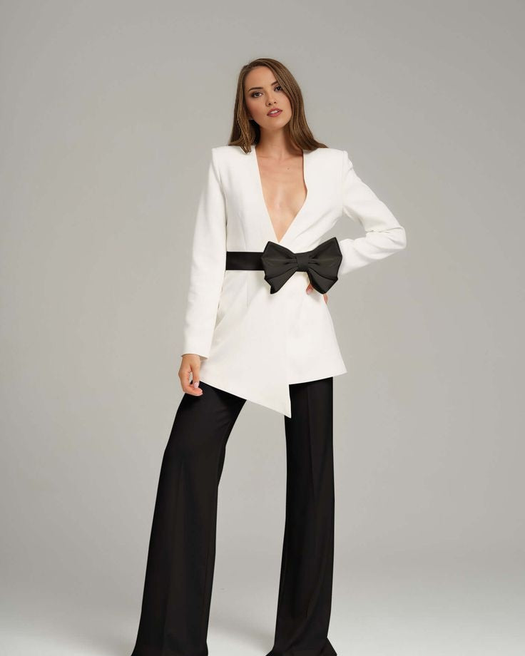 White blazer with black bow for formal business meetings.