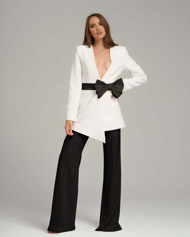 White blazer with black bow for formal business meetings.