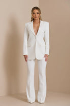 White double-breasted blazer suit set for formal business meetings.