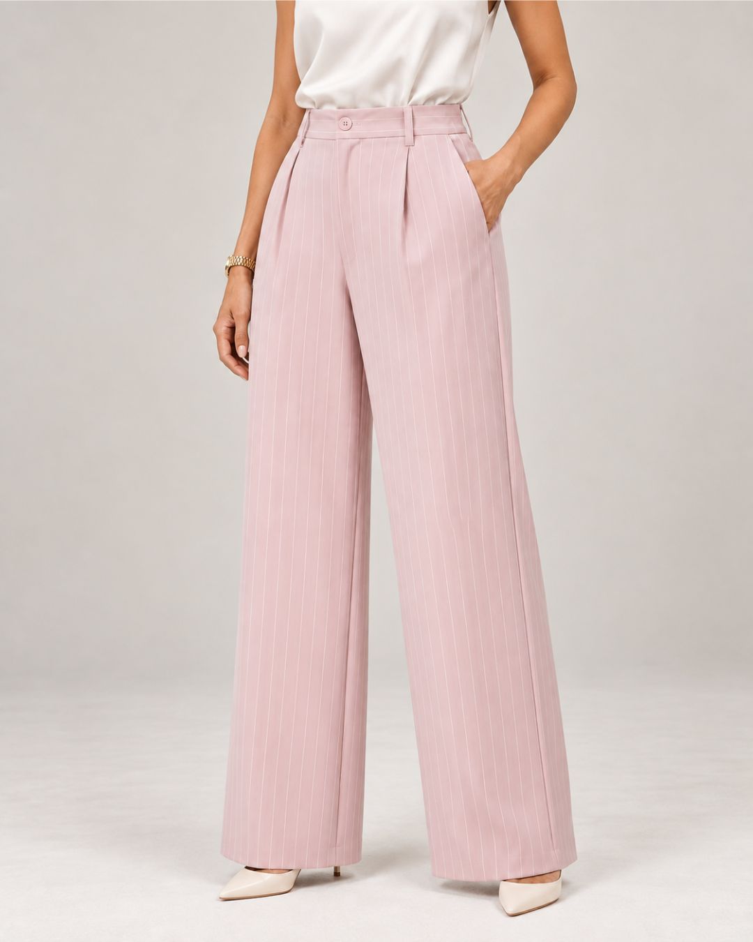 Light Pink pinstripe trousers styled with a satin blouse, close-up of waist and pockets | Beyond Formals