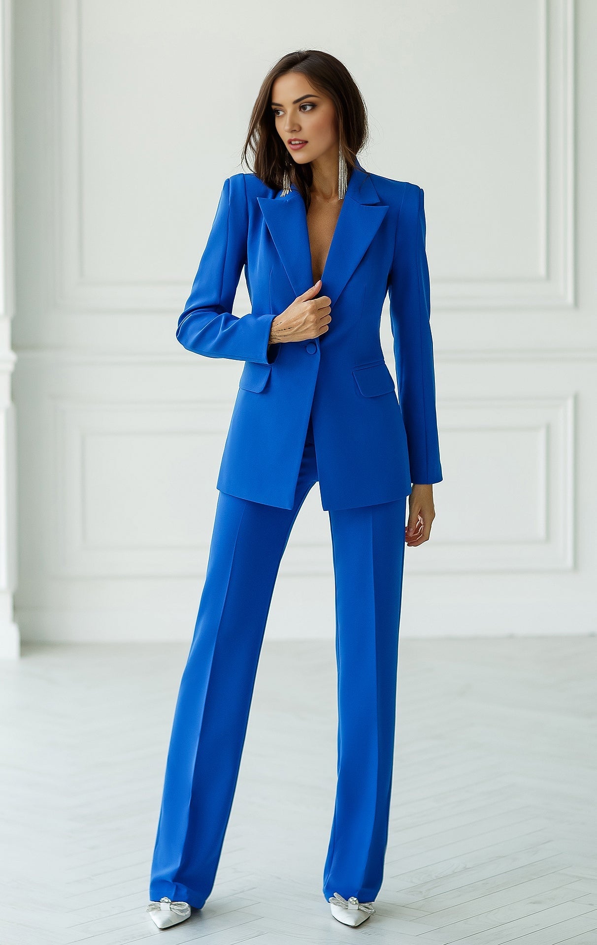 Blue double-breasted blazer suit set with straight fit trousers.