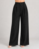 Black pinstripe trousers close-up of button waistband, front pleats and wide leg | Beyond Formals