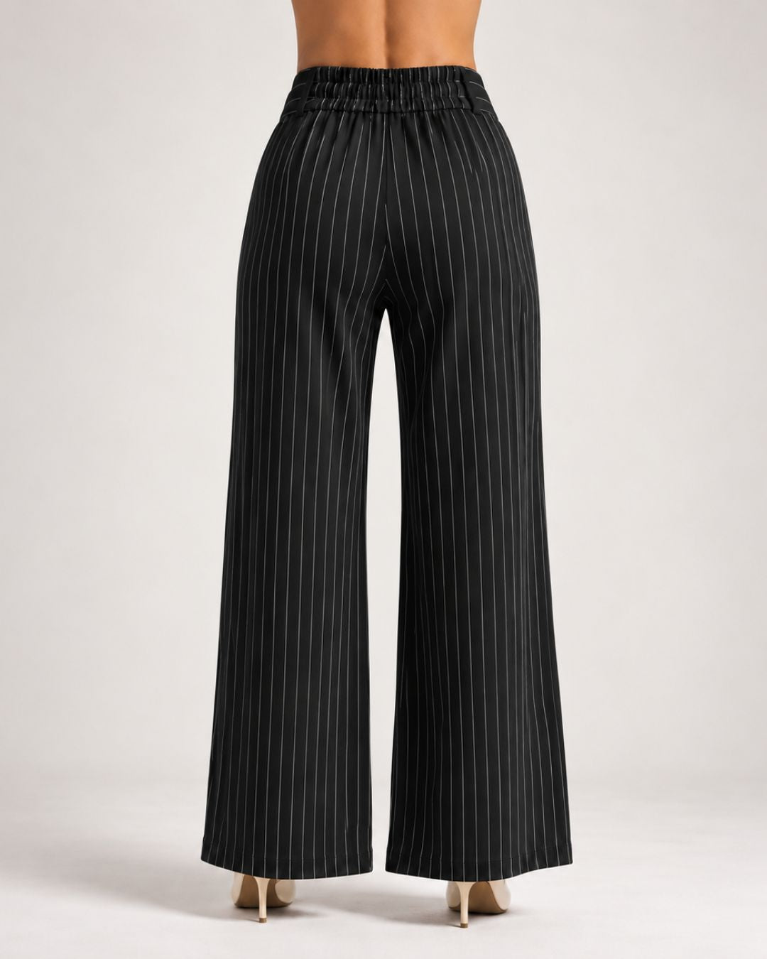 Back view of black pinstripe wide-leg trousers showing elasticated waistband | Beyond Formals