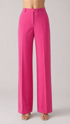 Bright pink pants on a plain background
