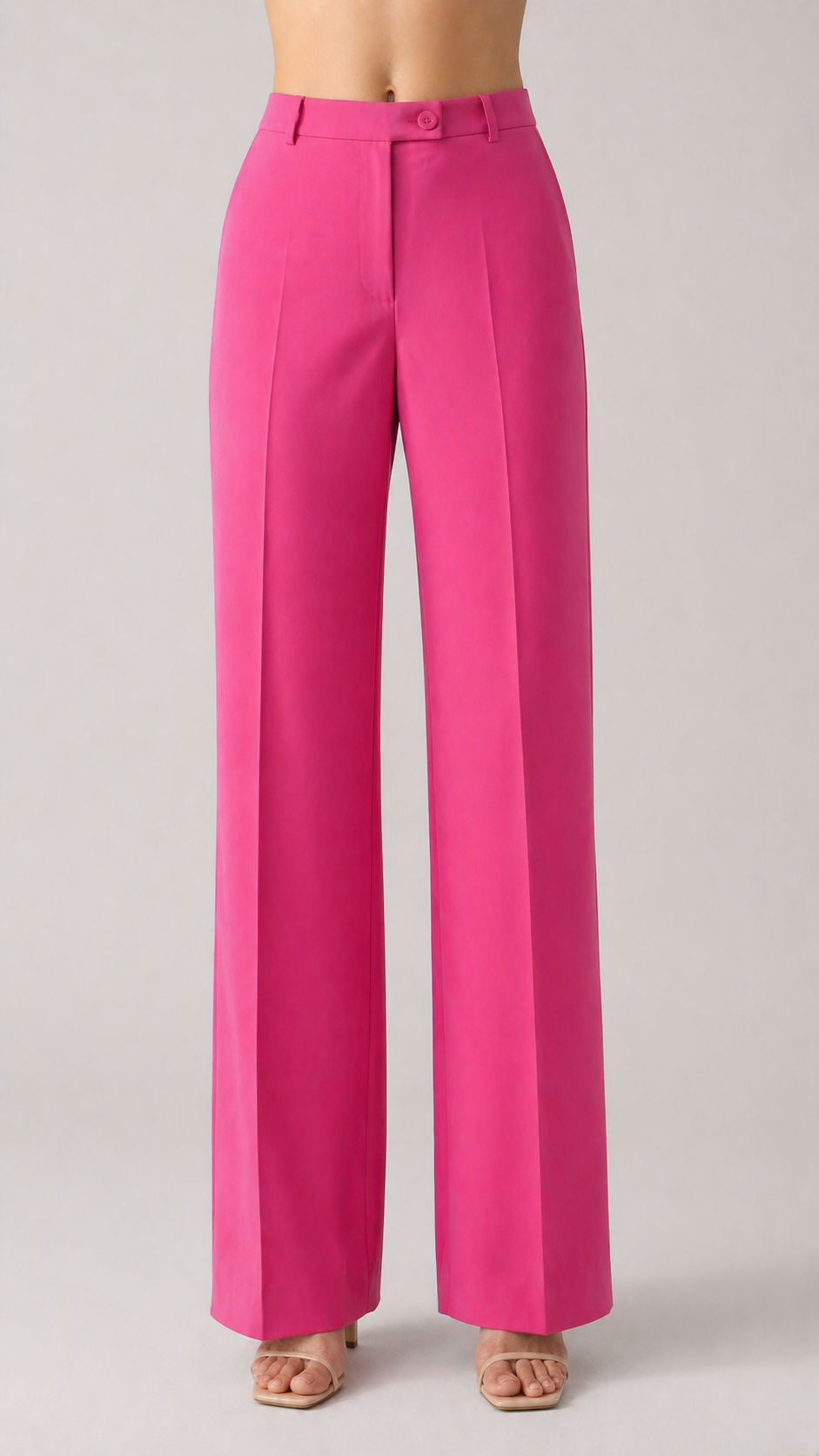 Bright pink pants on a plain background