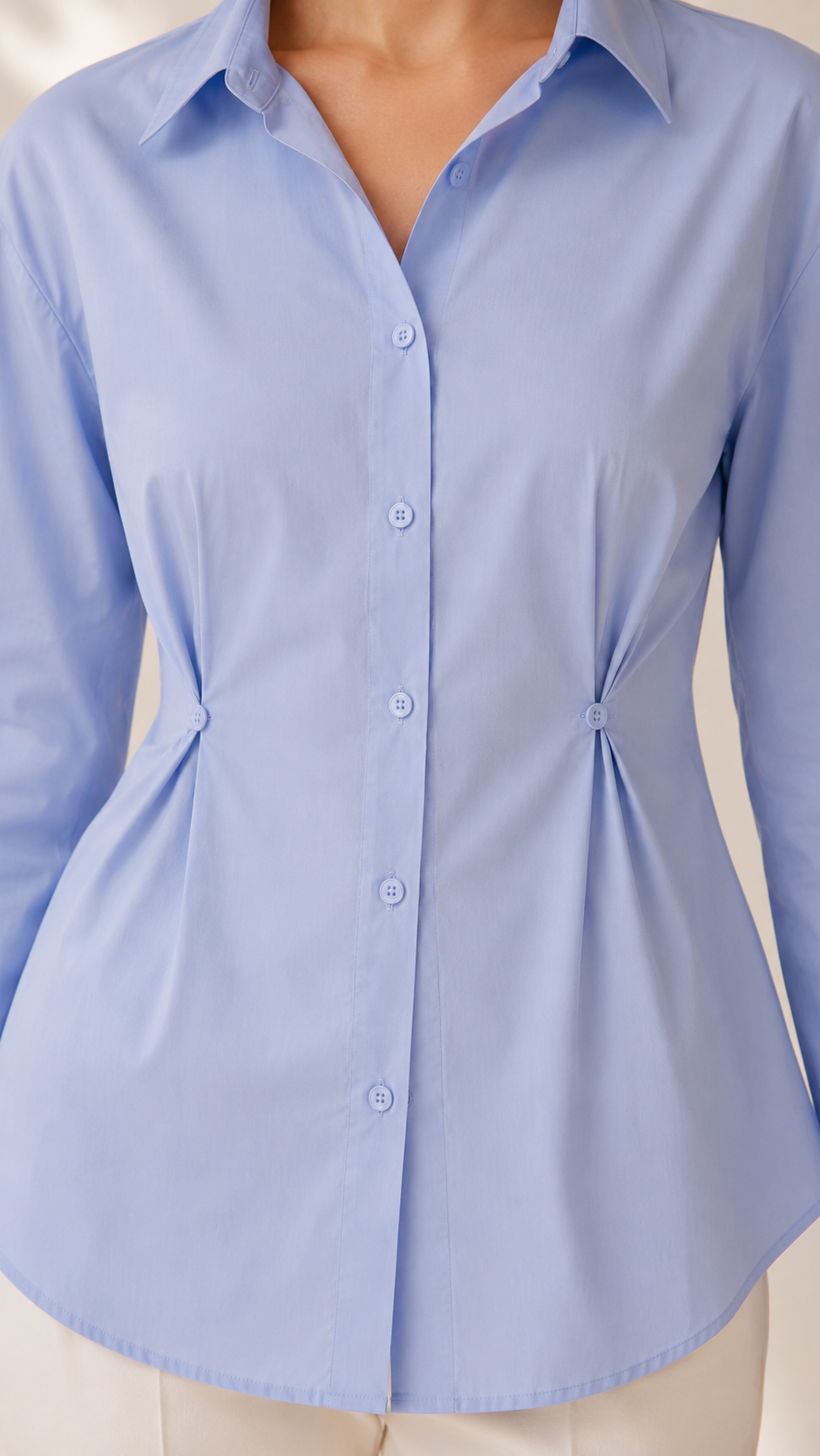 Powder blue shirt buttoned waist-cinch pleats and button front, close-up | Beyond Formals