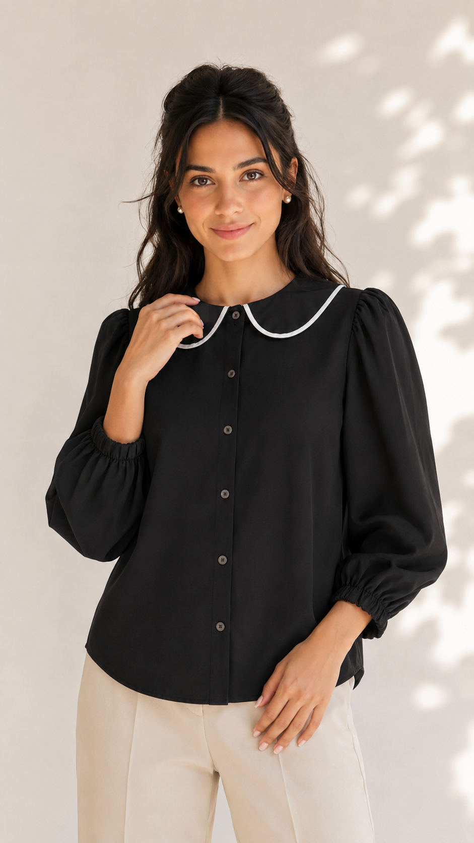Black button-front shirt with white-trimmed round collar and voluminous sleeves, close-up front view | Beyond Formals