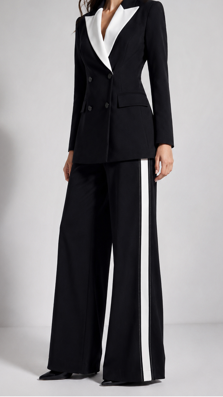 Black and white suit with wide-leg pants on a plain background