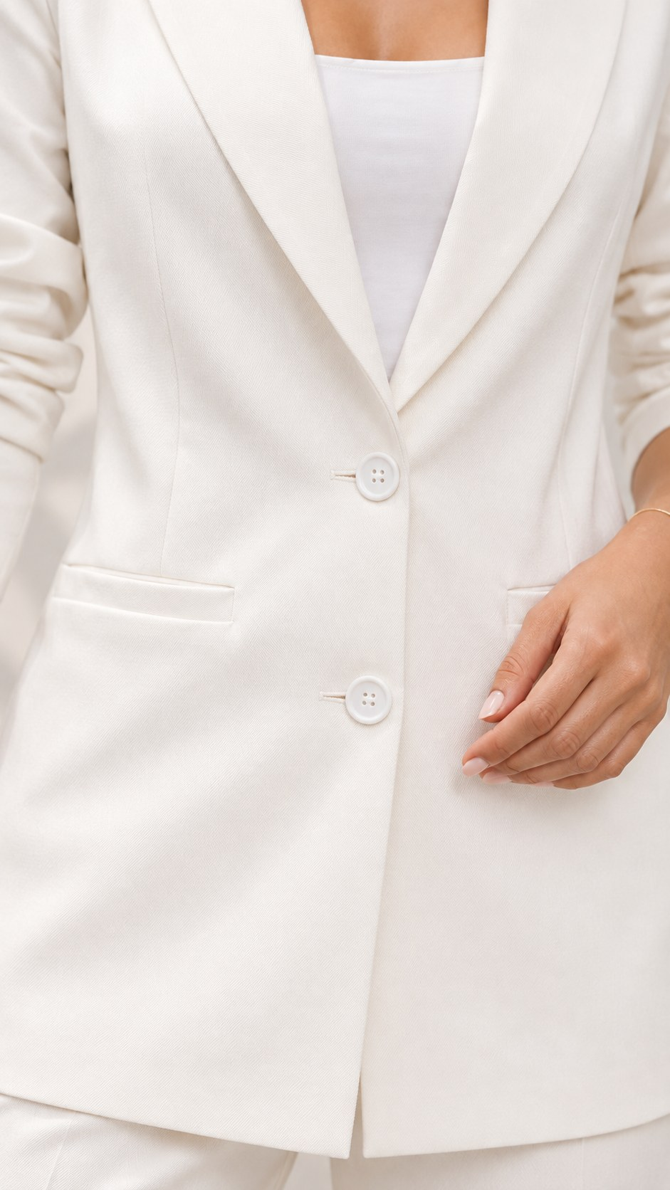 White blazer, close-up of buttons and welt pocket detail | Beyond Formals