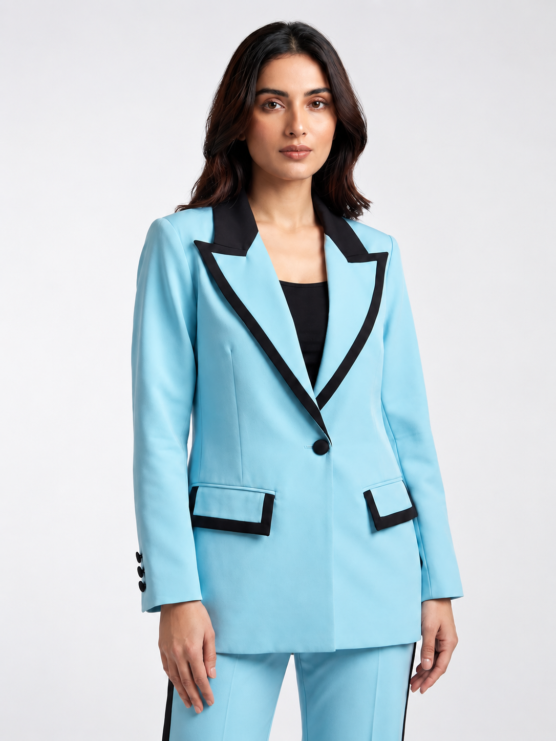 Sky blue blazer with black peak lapels and black-trimmed pockets on model, front view | Beyond Formals