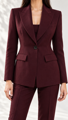 Maroon blazer close-up showing peak lapels, round button closure and flap pockets | Beyond Formals