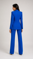 Woman wearing a blue suit on a white background