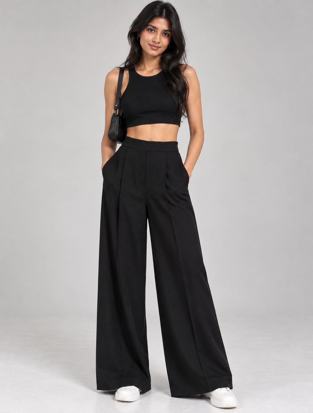 Black wide-leg pleated formal trousers with black crop top on model, full-length front view | Beyond Formals