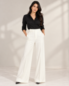 Off-white ultra high-waist wide-leg trousers with black shirt, full-length front view | Beyond Formals