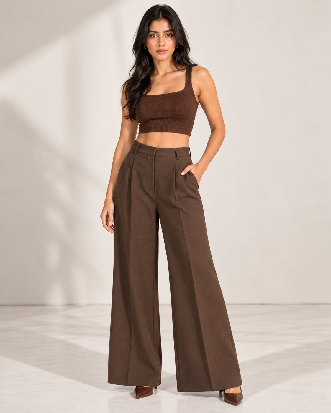 Brown high-rise wide-leg trousers on model with brown crop top, full front view | Beyond Formals