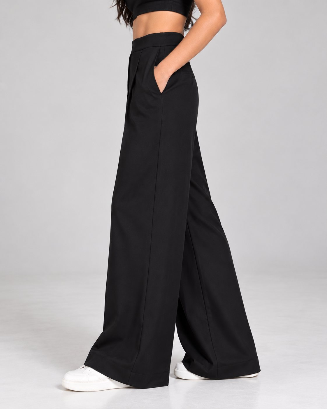Black wide-leg formal trousers, side view showing drape and side pocket | Beyond Formals