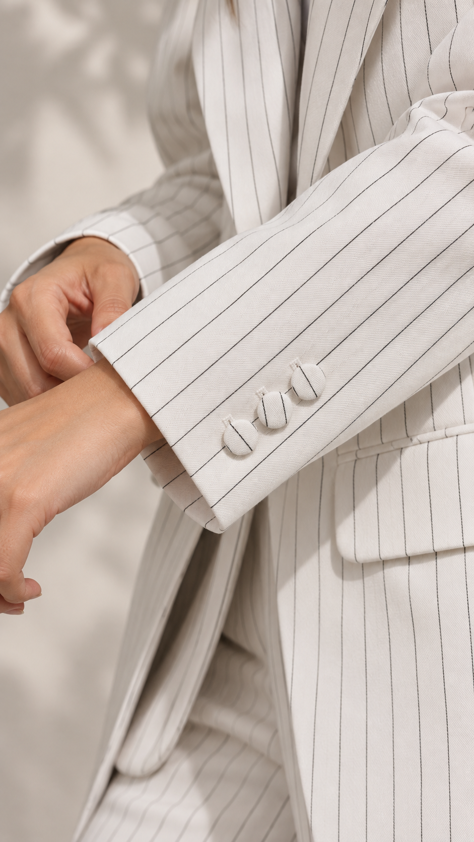 Ivory White Pinstripe blazer – close-up of fabric-covered cuff buttons and flap pocket | Beyond Formals