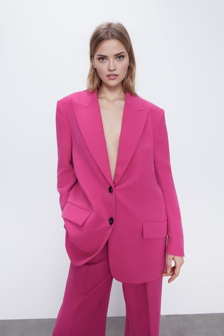 Pink oversized blazer suit set with high-waisted wide leg trousers.