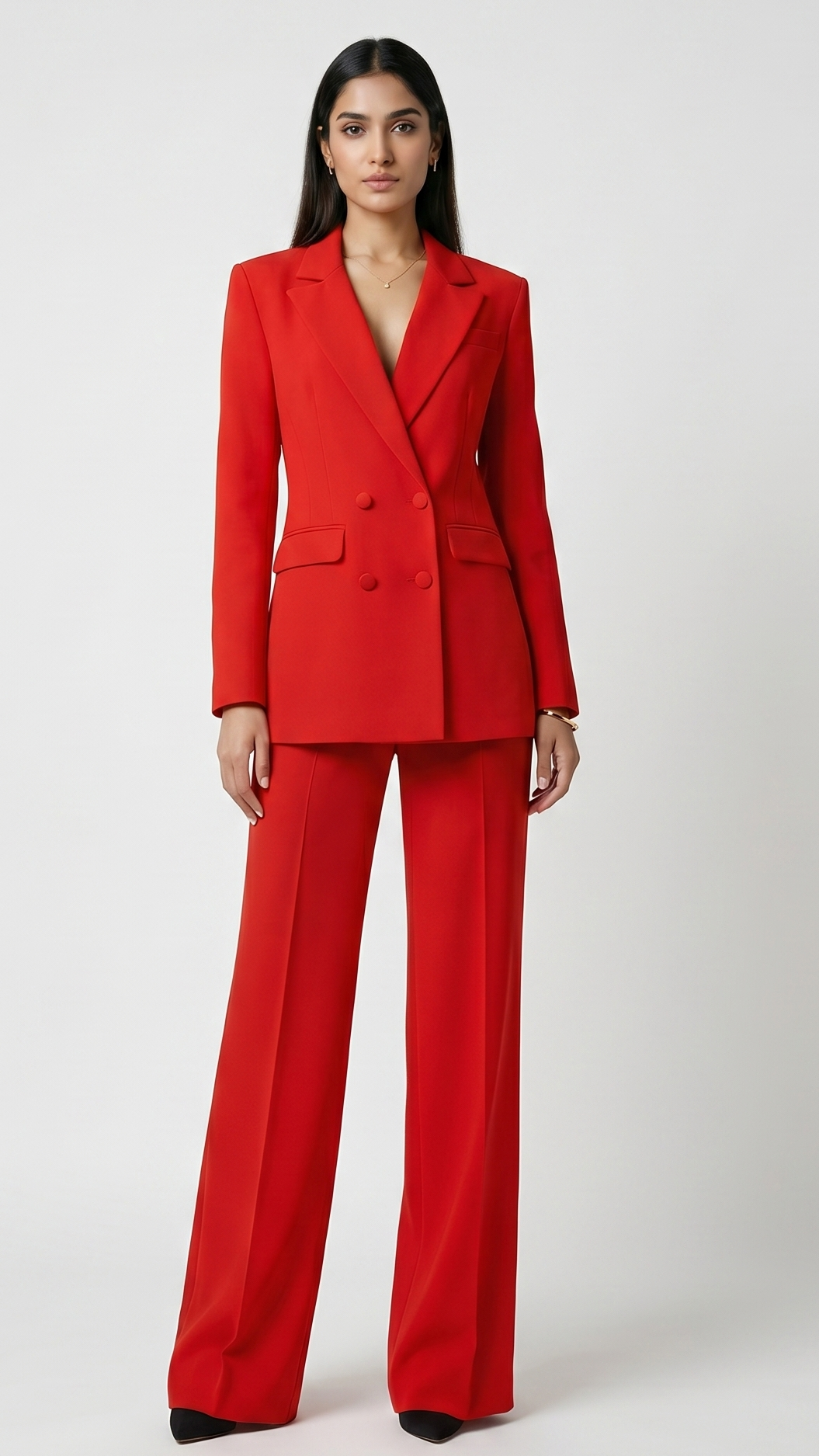 Woman wearing a red suit on a white background