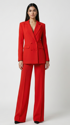 Woman wearing a red suit on a white background