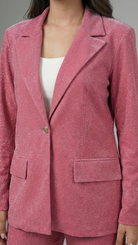 Pink blazer worn by a person on a gray background