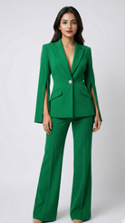 Woman wearing a green suit on a white background