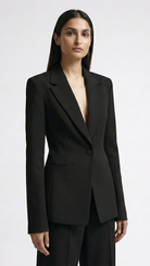 Woman wearing a black suit on a white background