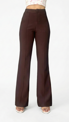 Brown flared pants on a white background