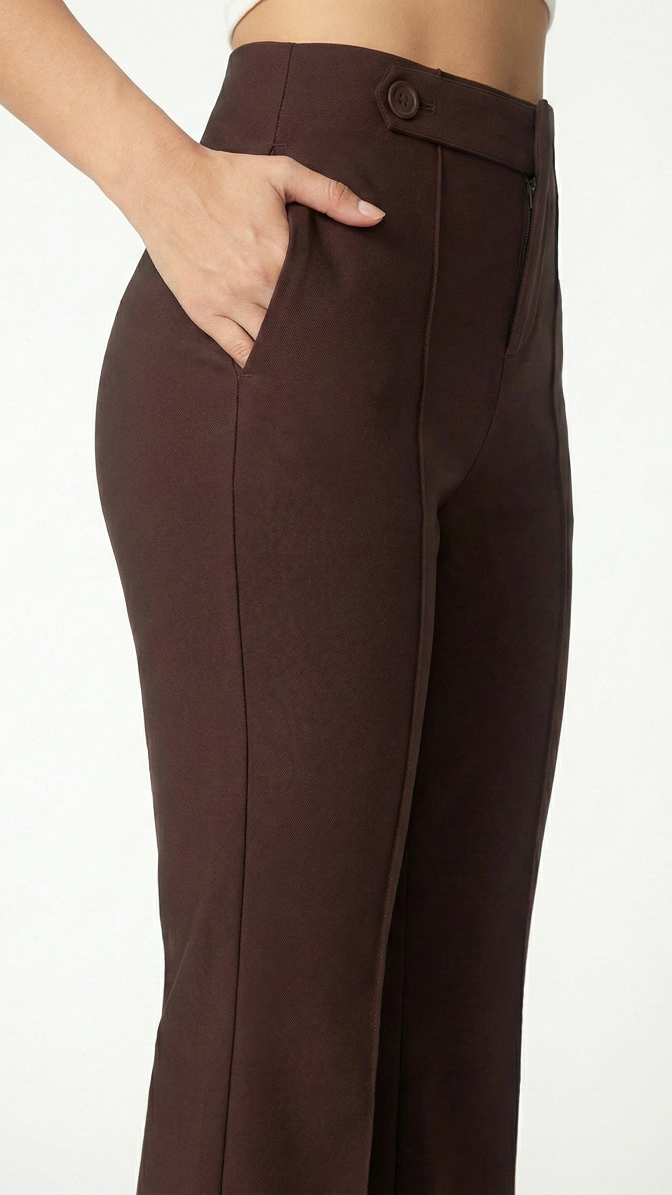 Brown pants worn by a person on a white background