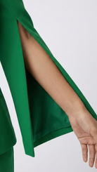 Green outfit with a slit sleeve on a white background
