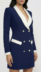 Navy blue blazer dress with white trim on a white background