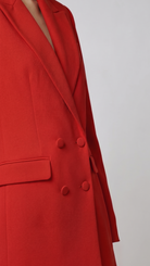Red blazer with a plain background