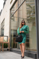 Women's green single-breasted blazer dress for minimalist styling.