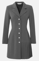 grey blazer dress with button detailing and a pleated hemline.