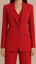 Red suit jacket with matching pants on a beige background