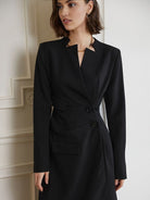 Women's black double-breasted blazer dress with a tailored fit.