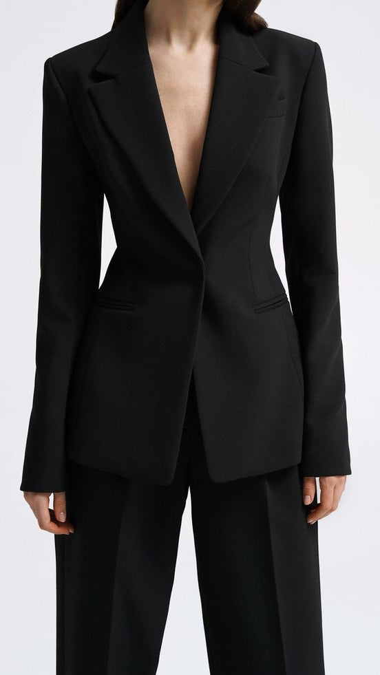 Women's black tailored blazer suit set with straight-fit trousers for office wear.