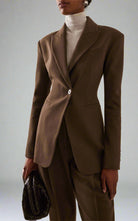 Women's brown fitted blazer with a notched lapel and single closure.