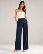 Navy pinstripe high-waist wide-leg trousers with white corset top, full-length front view | Beyond Formals
