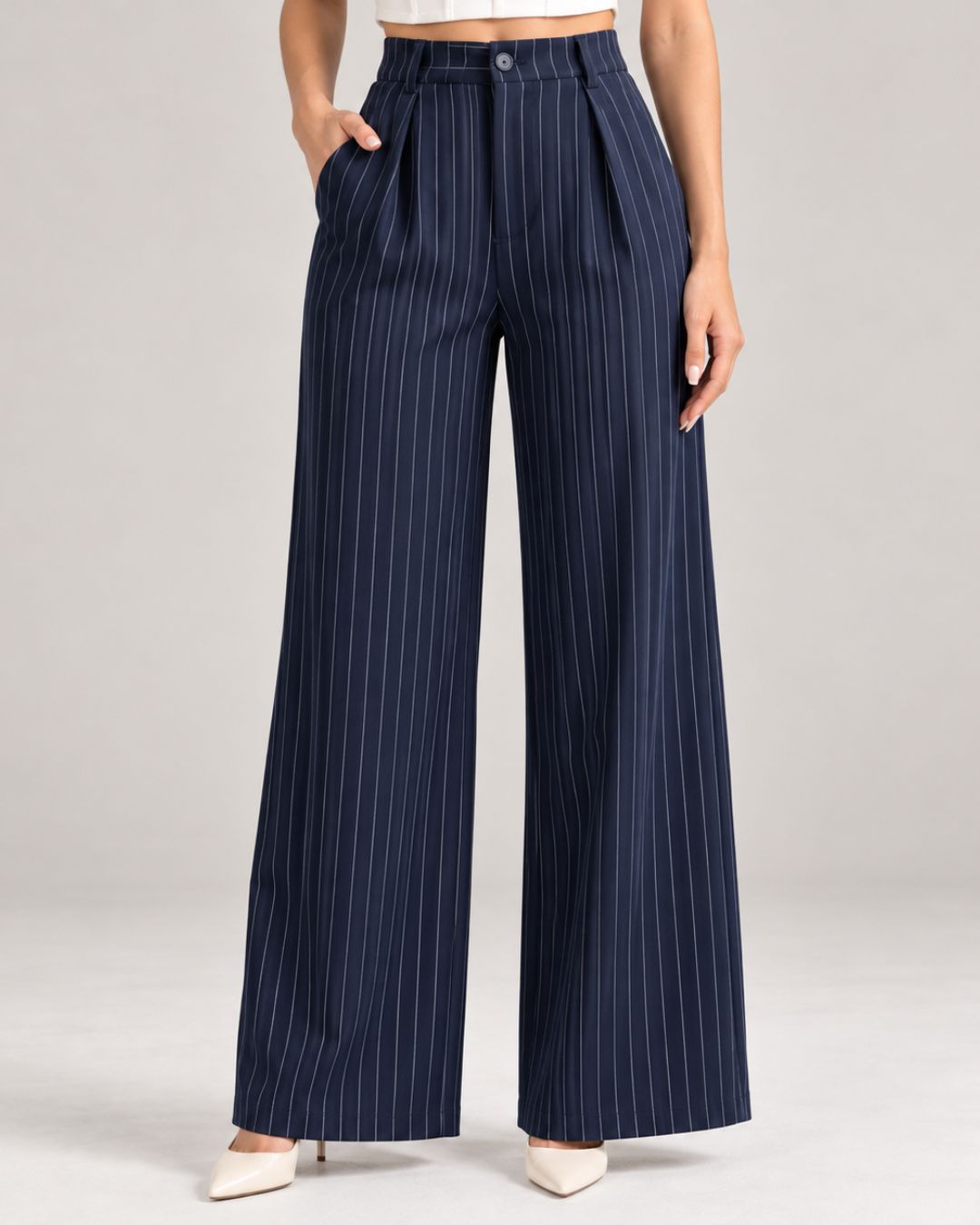 Navy pinstripe trousers close-up of button waistband, front pleats and pockets | Beyond Formals
