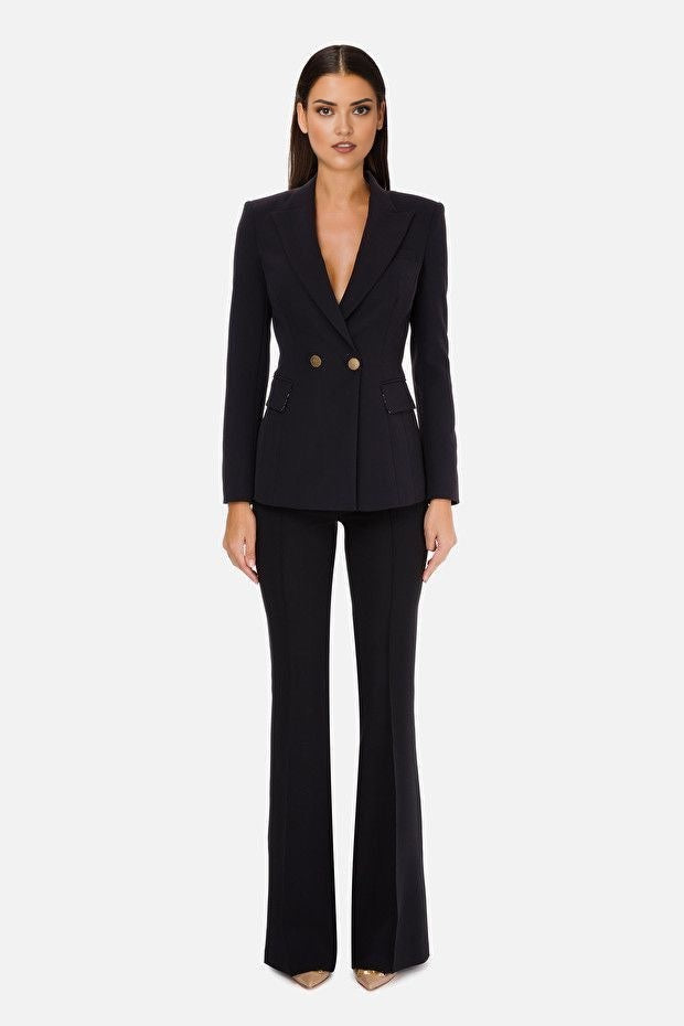 Women's black blazer with front flap pockets for chic styling.