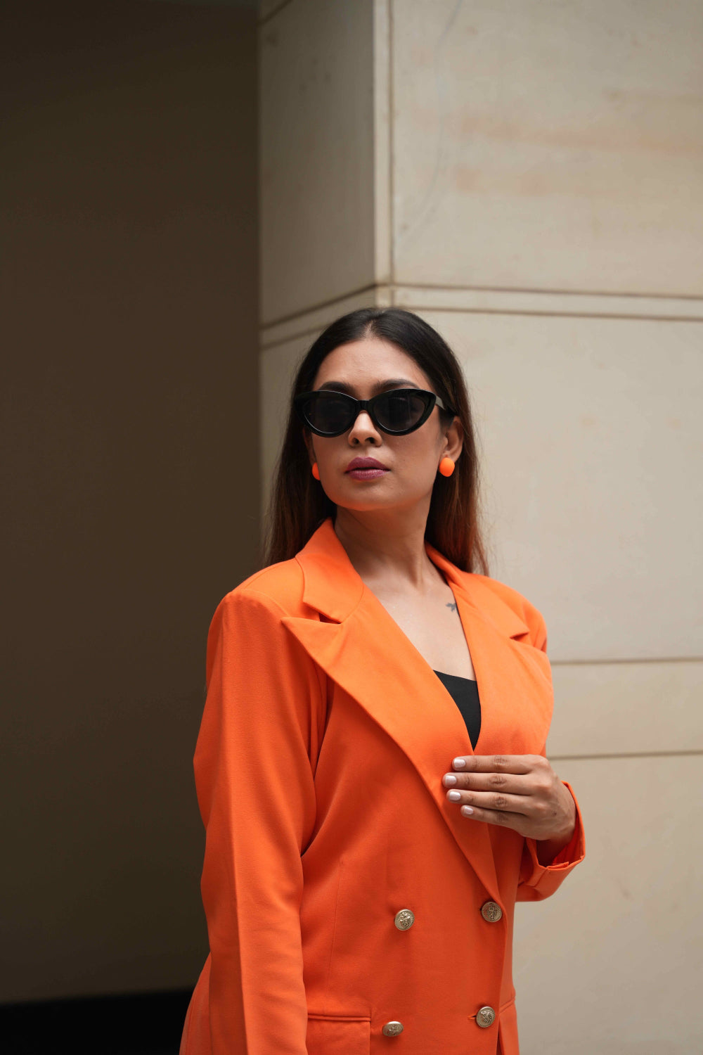 Women's orange blazer dress with front flap pockets for chic styling.